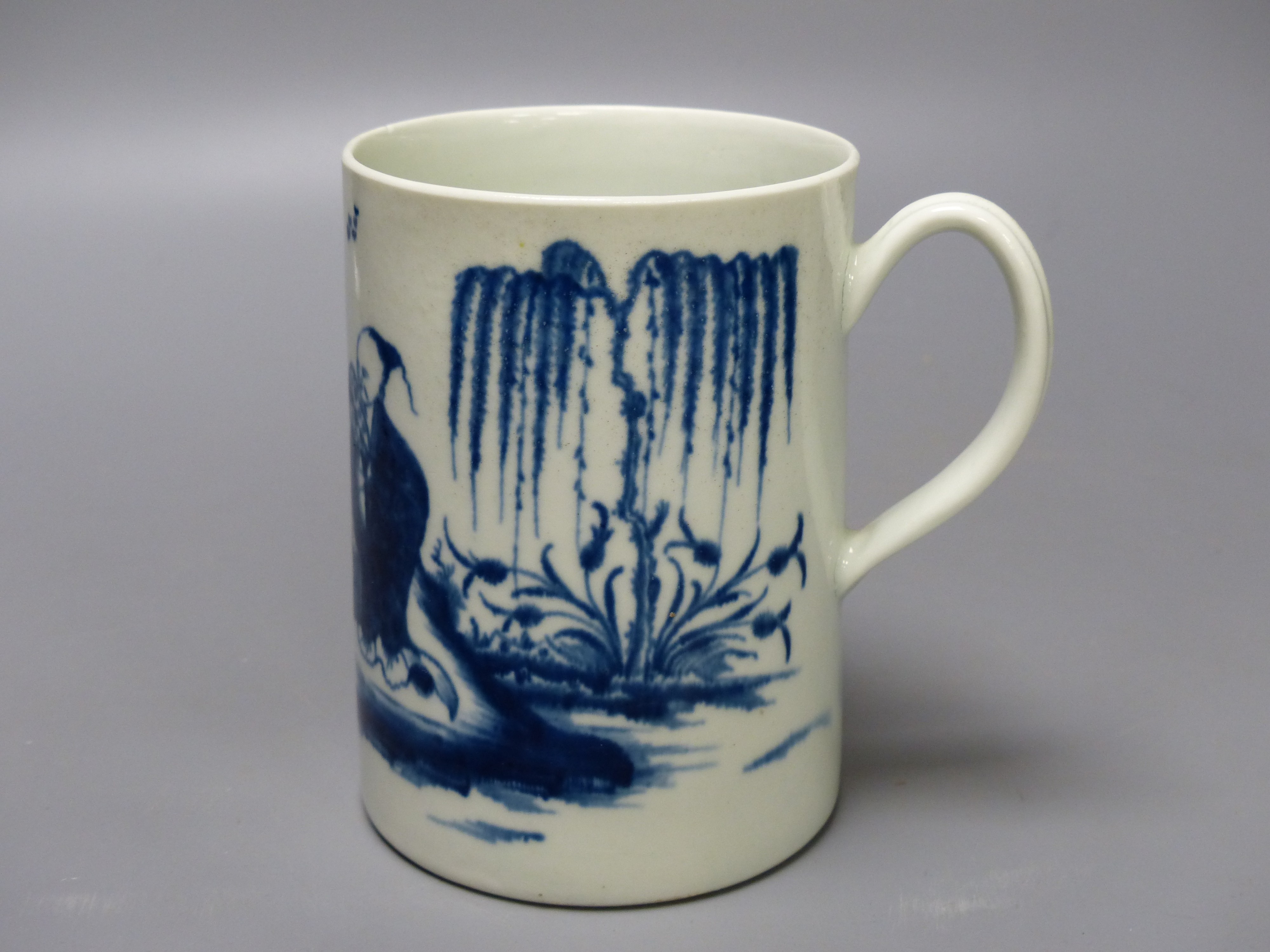 A Worcester 'Gardener' pattern cylinder mug, painted in blue, blue open crescent mark to base. 12.5cm high